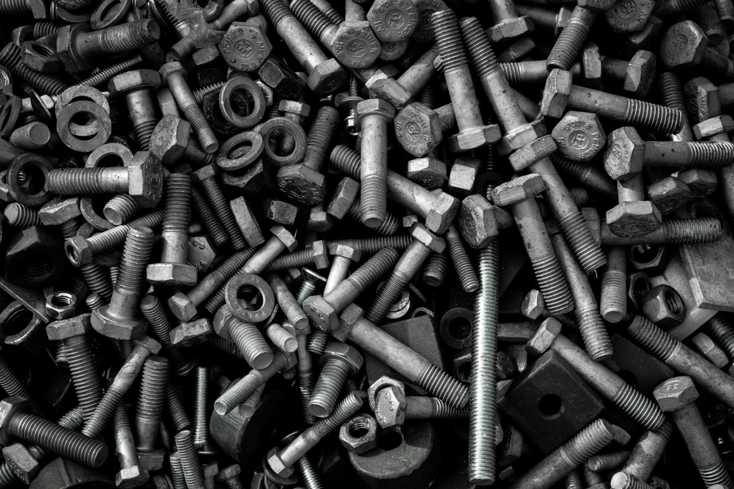 pexels-photo-5279361-5279361 Detailed image of assorted industrial bolts and screws for recycling or mechanics.